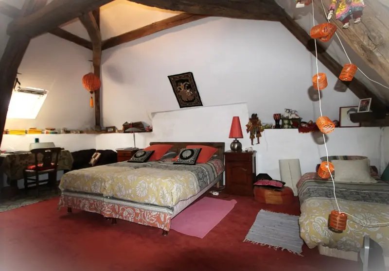 Attic bedroom with exposed timber beams